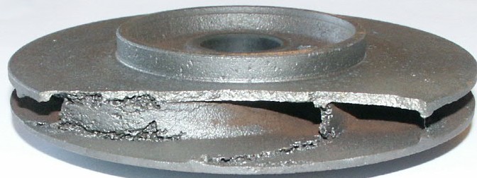 Photograph of a centrifugal pump impeller with cavitation damage