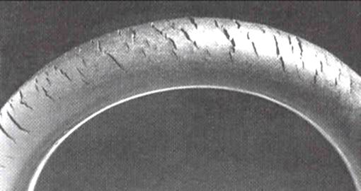 Real surface cracks along a natural rubber tube caused by ozone exposure