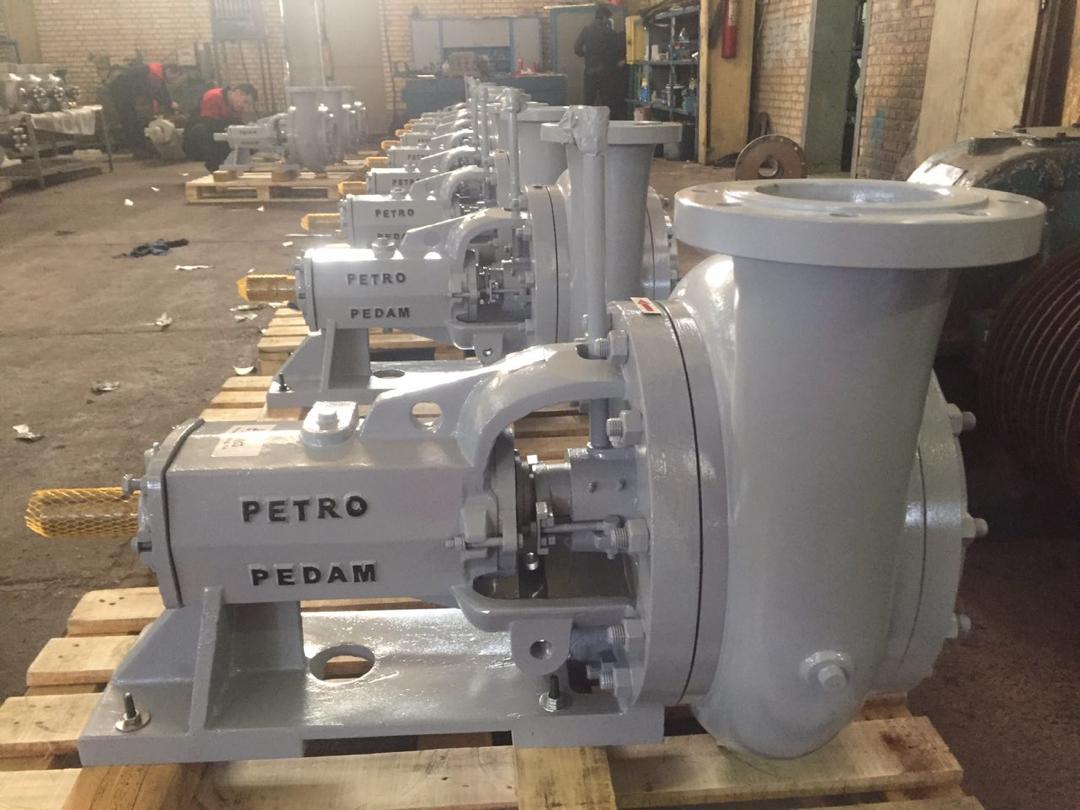 Real equipment photograph of a slurry pump inside a manufacturing facility